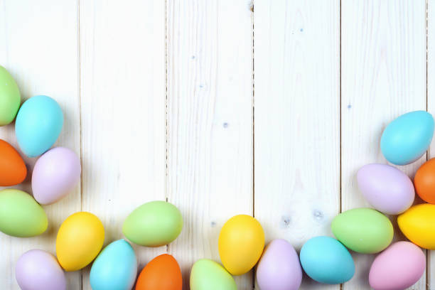 istock Several bright color dyed easter eggs on wooden background 1300362906