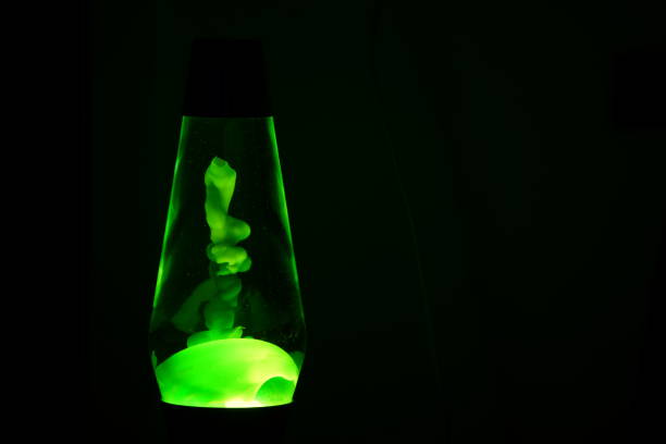 green lava lamp. - lava lamp imagens e fotografias de stock