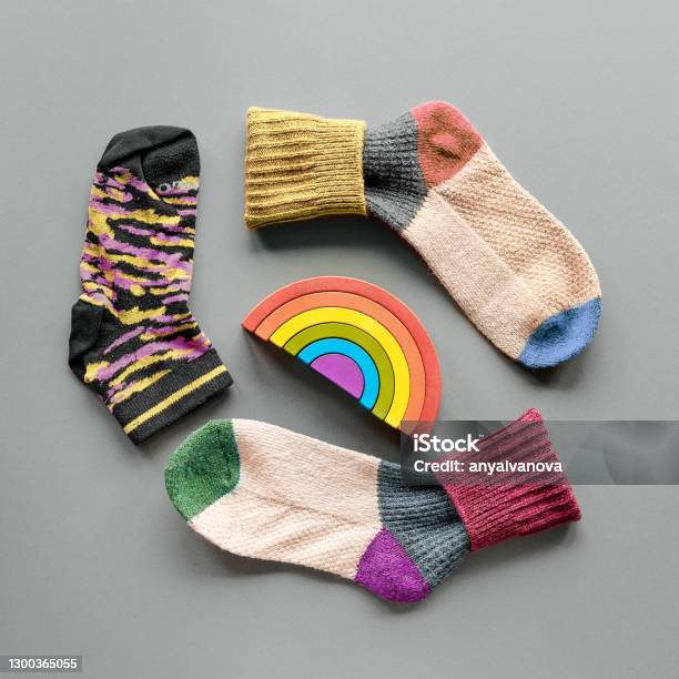Odd Socks Day Mismatched Socks And Rainbow Toy Social Initiative Against Bullying In School Or Workplace Design Of Poster For Antibullying Campaign Stock Photo - Download Image Now