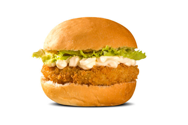 istock Close up on crispy chicken burger with lettuce and tomato. 1300365161