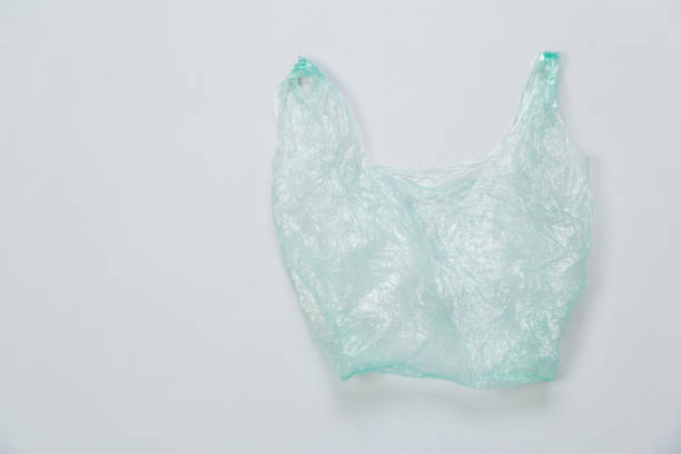 istock Clear blue disposable plastic bag on gray background. Space for text 1300366591