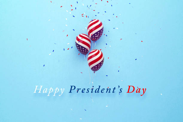 President's Day Message Sitting Below Balloons and Falling Confetti Textured with American Flag on Blue Background President's Day message sitting below balloons and confetti textured with American flag on blue background. Horizontal composition with copy space. Directly above. Happy President's Day concept. presidents day stock pictures, royalty-free photos & images