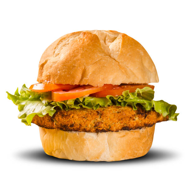 istock Close up on crispy chicken burger with lettuce and tomato. 1300368225