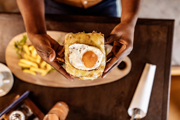 One man is holding a fresh burger before eating