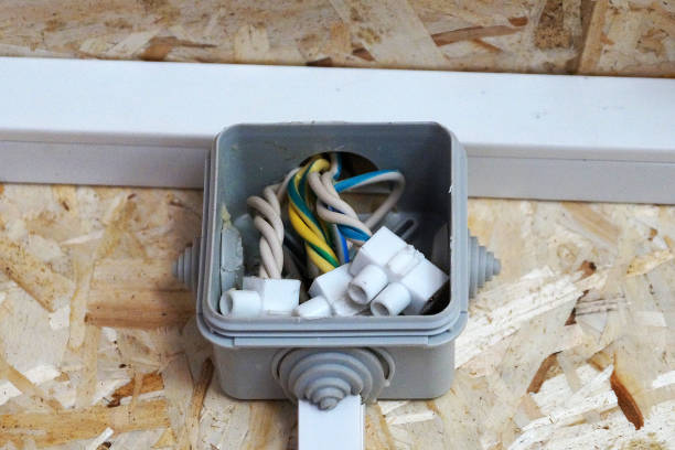 junction box on the wall made of osb plywood - electrical junction box imagens e fotografias de stock