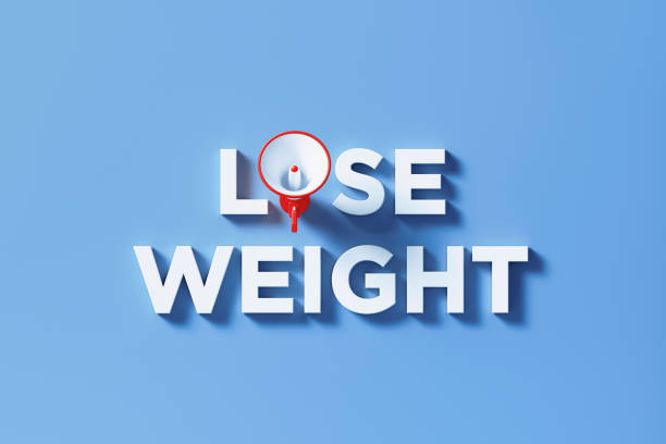 istock Lose Weight Written By Red Megaphone on Blue Background 1300371638