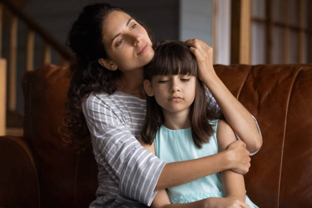 istock Close up caring mother hugging, calming upset little daughter 1300371752