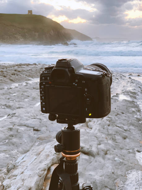 istock DSLR camera on a tripod in a beach 1300372093