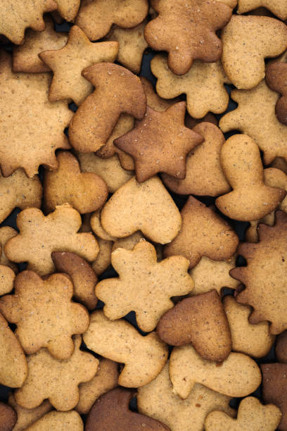 istock homemade curly gingerbread cookies lay in a continuous layer. view from above. art background or wallpaper for creative food design 1300375898