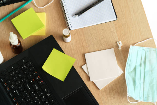 istock Medicine bottle on an office table with laptop 1300376867