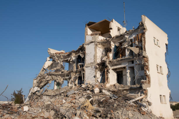 istock Ruins of an abandoned and demolished building. Development, construction site 1300378705