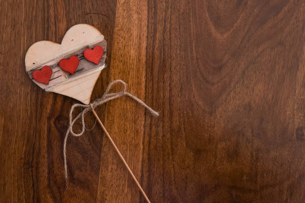 istock Three small red hearts in one big heart 1300380094