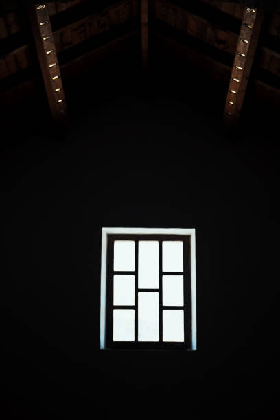 istock backlit window in the dark and light geometries 1300380132