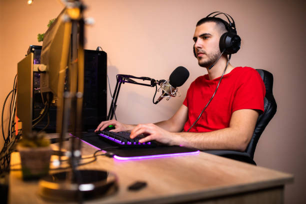 istock A young man playing games online 1300381127