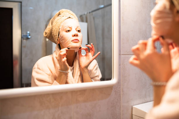 istock A beautiful young woman applying a sheet mask 1300385781