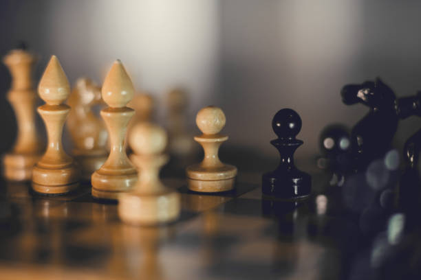 istock Wooden chess pieces on the chessboard. 1300387226