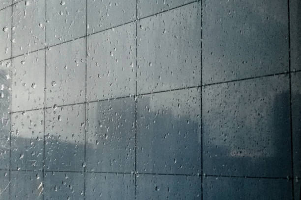 istock buildings are reflected in the glossy wall of a skyscraper 1300387622