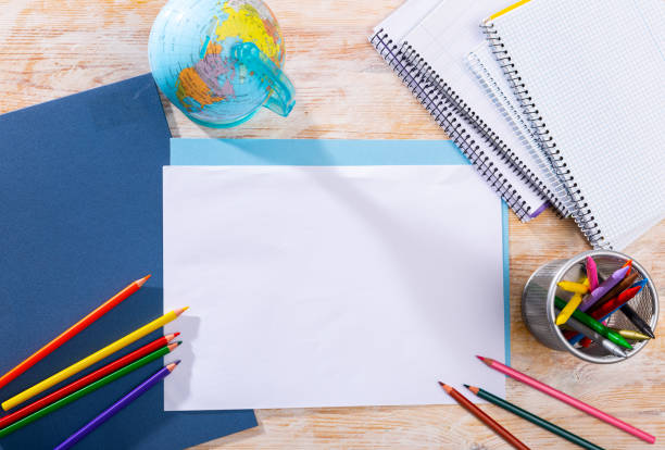 istock School supplies on the table. Space for text 1300387723