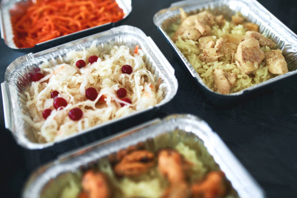 istock Different foil containers with delicious food. 1300388698
