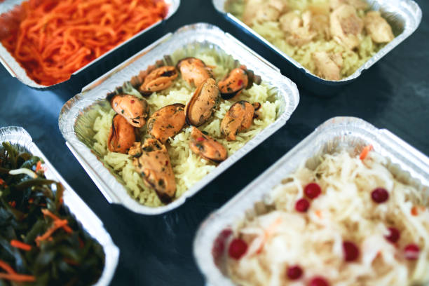 istock Different foil containers with delicious food. 1300388702