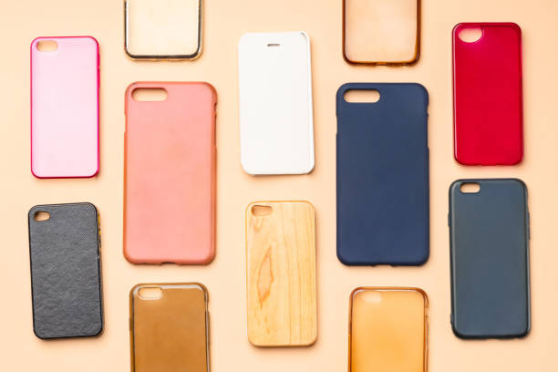 istock Pile of multicolored plastic back covers for mobile phone. Choice of smart phone protector accessories on neutral background. A lot of silicone phone backs or skins next to each other 1300388831