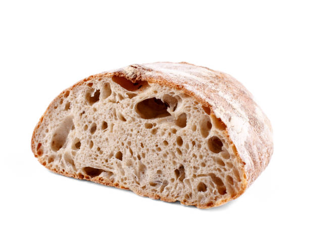 istock Brown sliced bread three quarters view isolated on white background. Loaf photo 1300391131