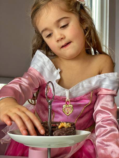istock Toddler enjoying afternoon tea 1300392989