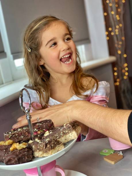 istock Toddler enjoying afternoon tea 1300393003