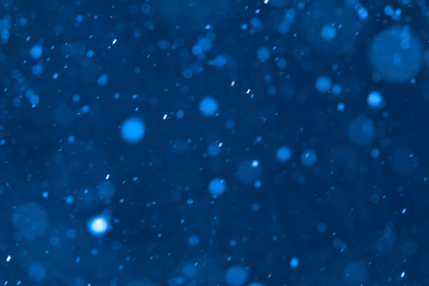 istock Snowing in a icy cold night 1300393060