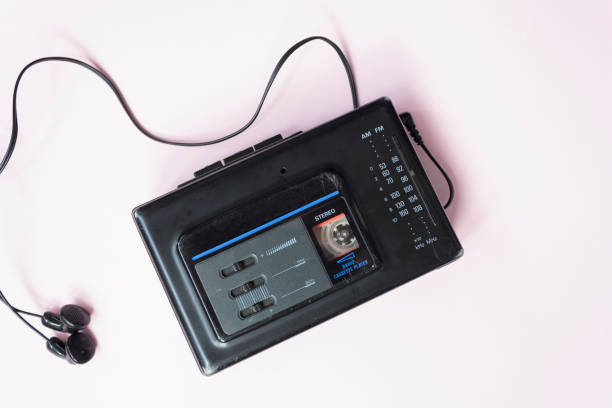 istock Retro walkman and headphones on pink background 1300393798