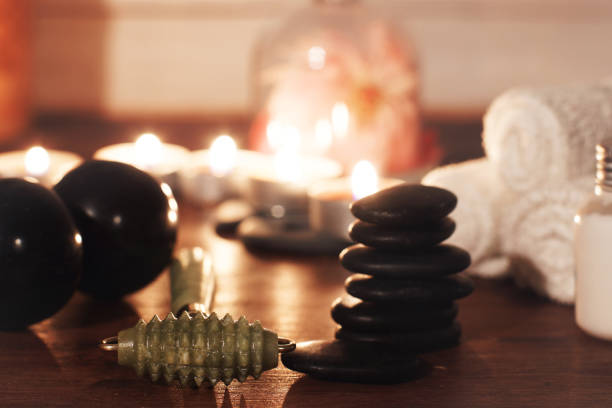 istock green jade roller for facial massage on a table with spa accessories 1300394075