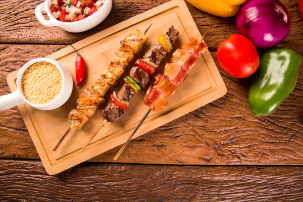 istock Assorted steak skewers on top of a board 1300395727