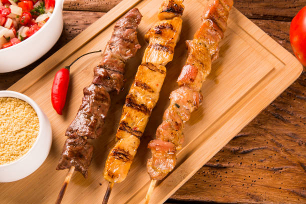 istock Assorted steak skewers on top of a board 1300396833