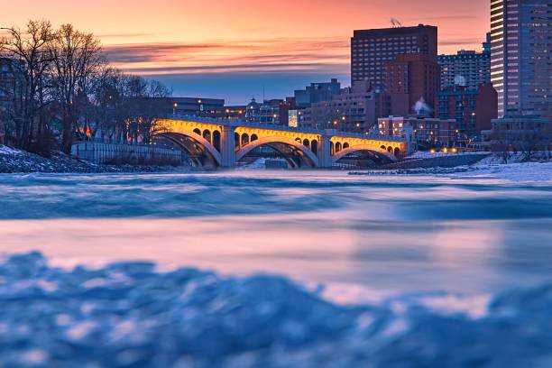 istock Sunrise Sky Glowing Over A Wintry Bow River By Downtown Calgary 1300397968