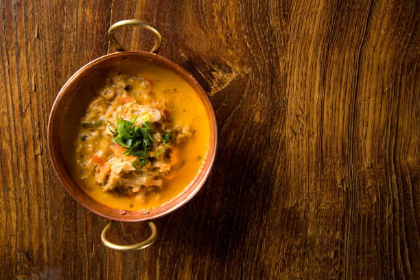istock Moqueca, crab stew in metal bown. 1300398024