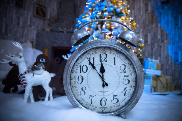 istock Alarm clock and christmas lights 1300398097