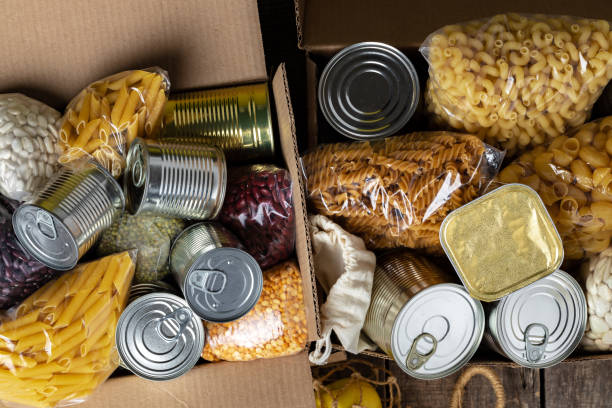 Food donations on the table. Text Donation. stock photo