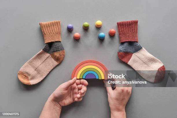 Odd Socks Daymismatched Socks Wooden Rainbow And Toy Figures Social Initiative Against Bullying In School Or Workplace Design For Antibullying Campaign Visual Stock Photo - Download Image Now
