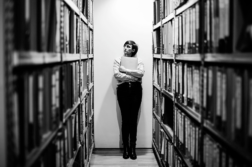 Young woman in library. Education concept
