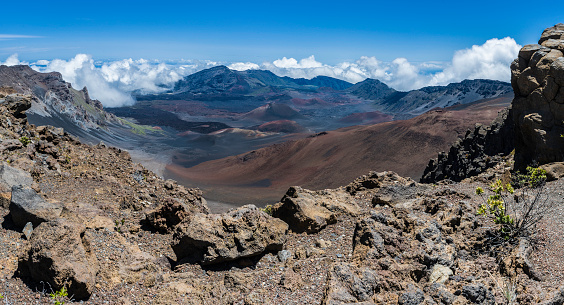 Haleakal; East Maui Volcano, a  shield volcano that forms more than 75% of the Hawaiian Island of Maui. Haleakala National Park; Hawaiian Islands; Maui Island. Showing the erroded valley and cinder cones.