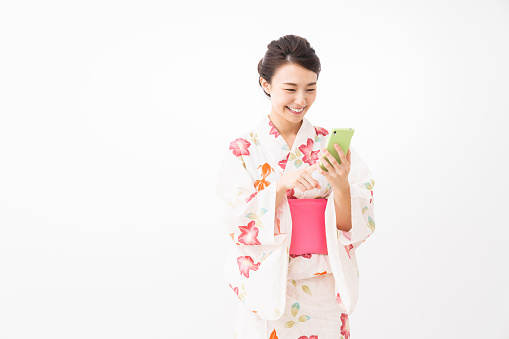 attractive asian woman wearing traditional Japanese casual summer kimono called 