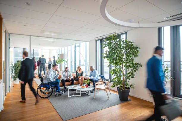 istock Businesspeople Coming and Going Through Office Lobby 1300410172