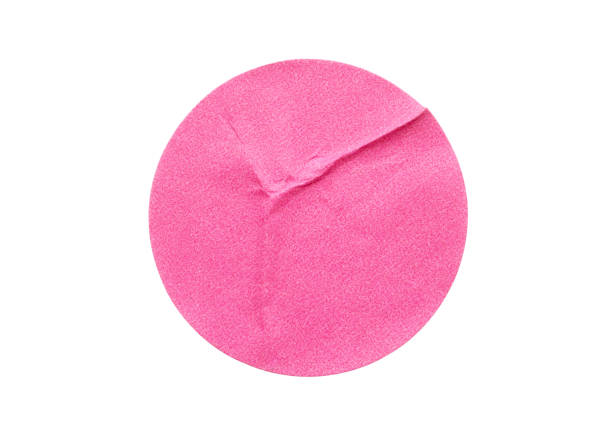 istock Blank pink round adhesive paper sticker label isolated on white background 1300410776