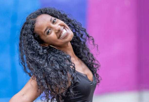 istock Beautiful woman in front of Pride mural 1300411011