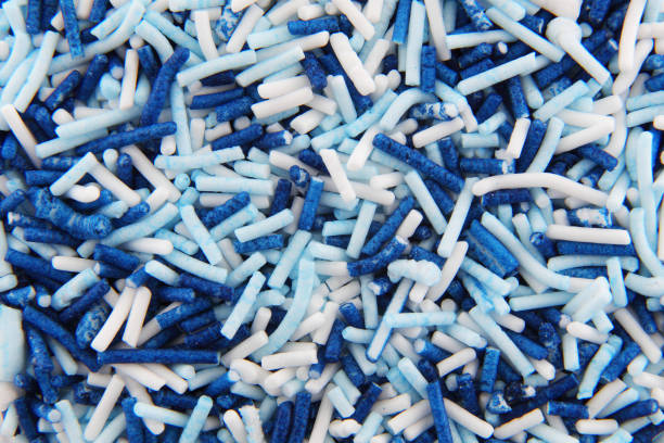 istock White and blue hundreds and thousands sprinkles sugar beads used for decorating cakes and desserts 1300422198