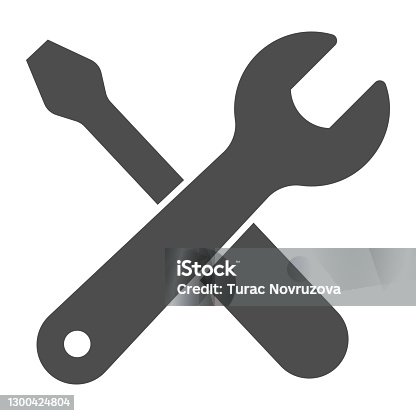 istock Wrench and screwdriver solid icon, labour day concept, repair equipment sign on white background, screwdriver and wrench icon in glyph style for mobile and web design. Vector graphics. 1300424804