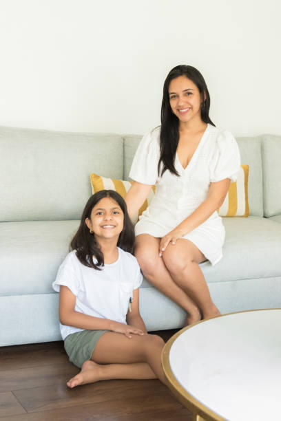 istock Cute mothers and daughter showing affection to each other 1300426595
