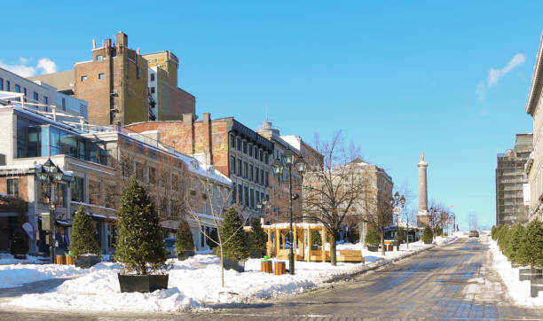 Vieux Montreal Place Jacques Cartier on a clear Winter day Vieux Montreal Place Jacques Cartier on a clear Winter day. The square is uncharacteristically deserted due to the Covid 19 lockdown in early February 2021 place jacques cartier stock pictures, royalty-free photos & images