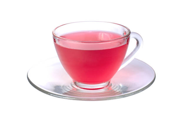 jugo rojo en taza de vidrio con platillo aislado sobre fondo blanco - flower cherry cup tea fotografías e imágenes de stock
