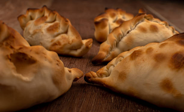 istock Traditional Argentinean empanadas pie on table, meat Chicken and vegetables 1300432428